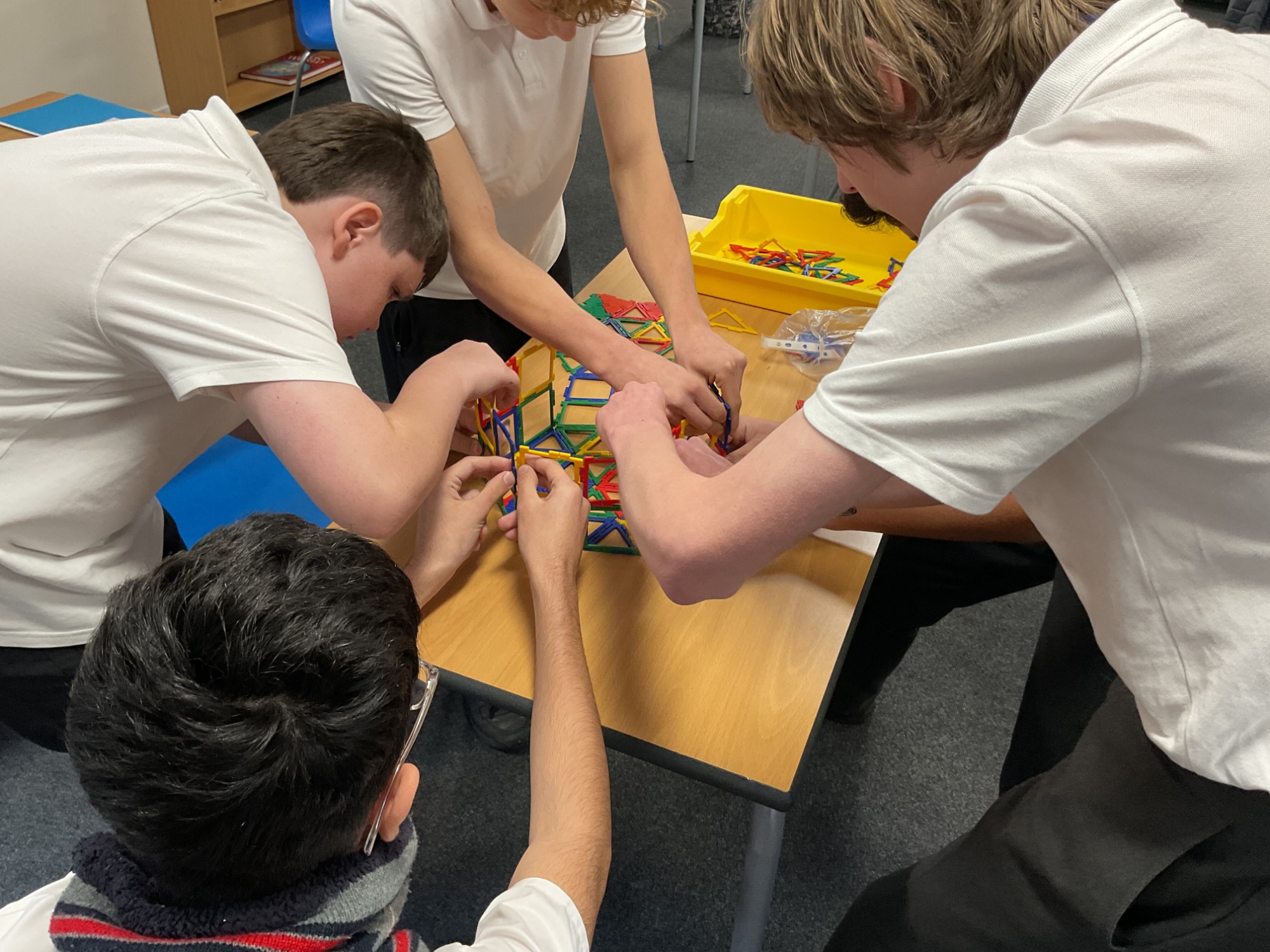 Neptune constructing a net of shapes