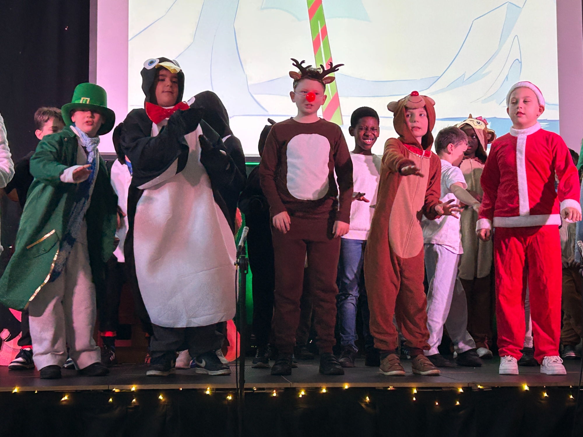 A full stage with lots of students dressed up as different characters