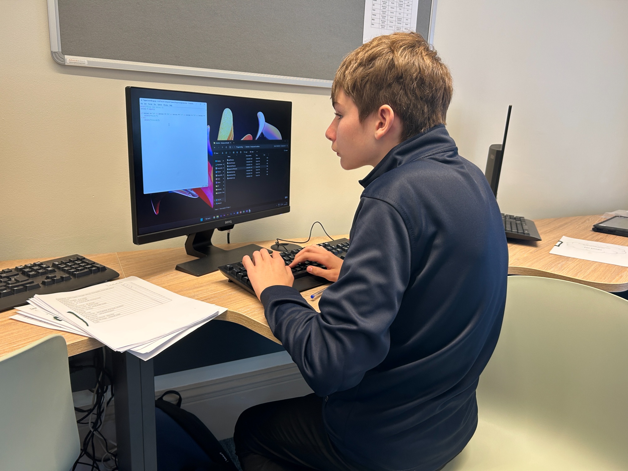 Student at a computer in the new IT suite