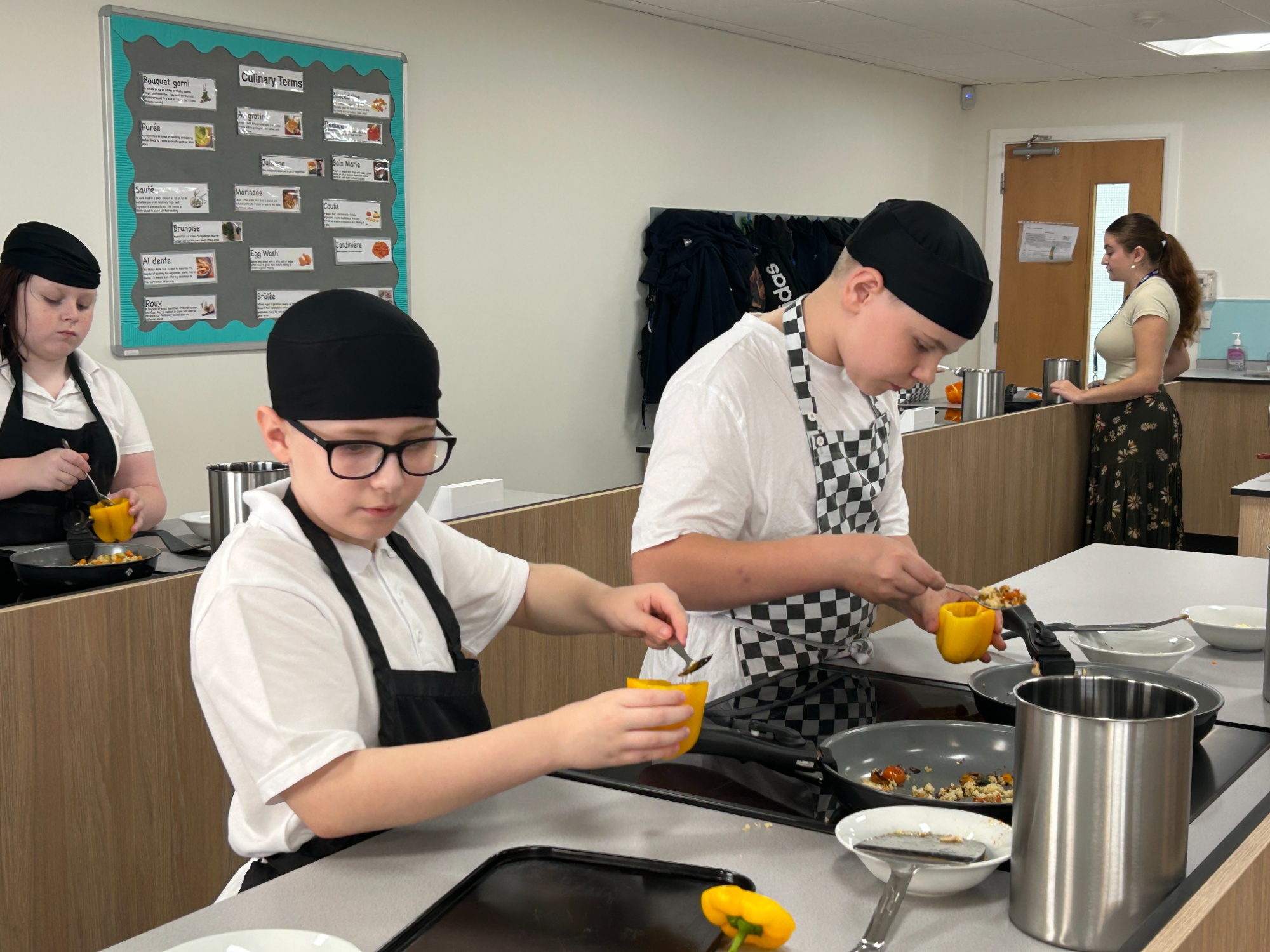 Overview of studetns cooking in the new catering classroom