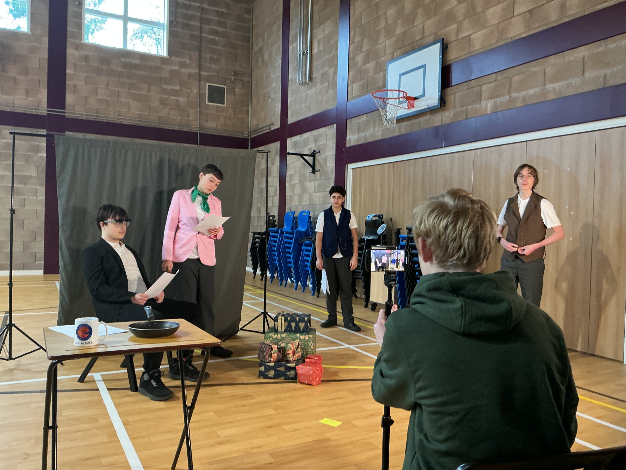 Workshop in action, three students acting and one filming