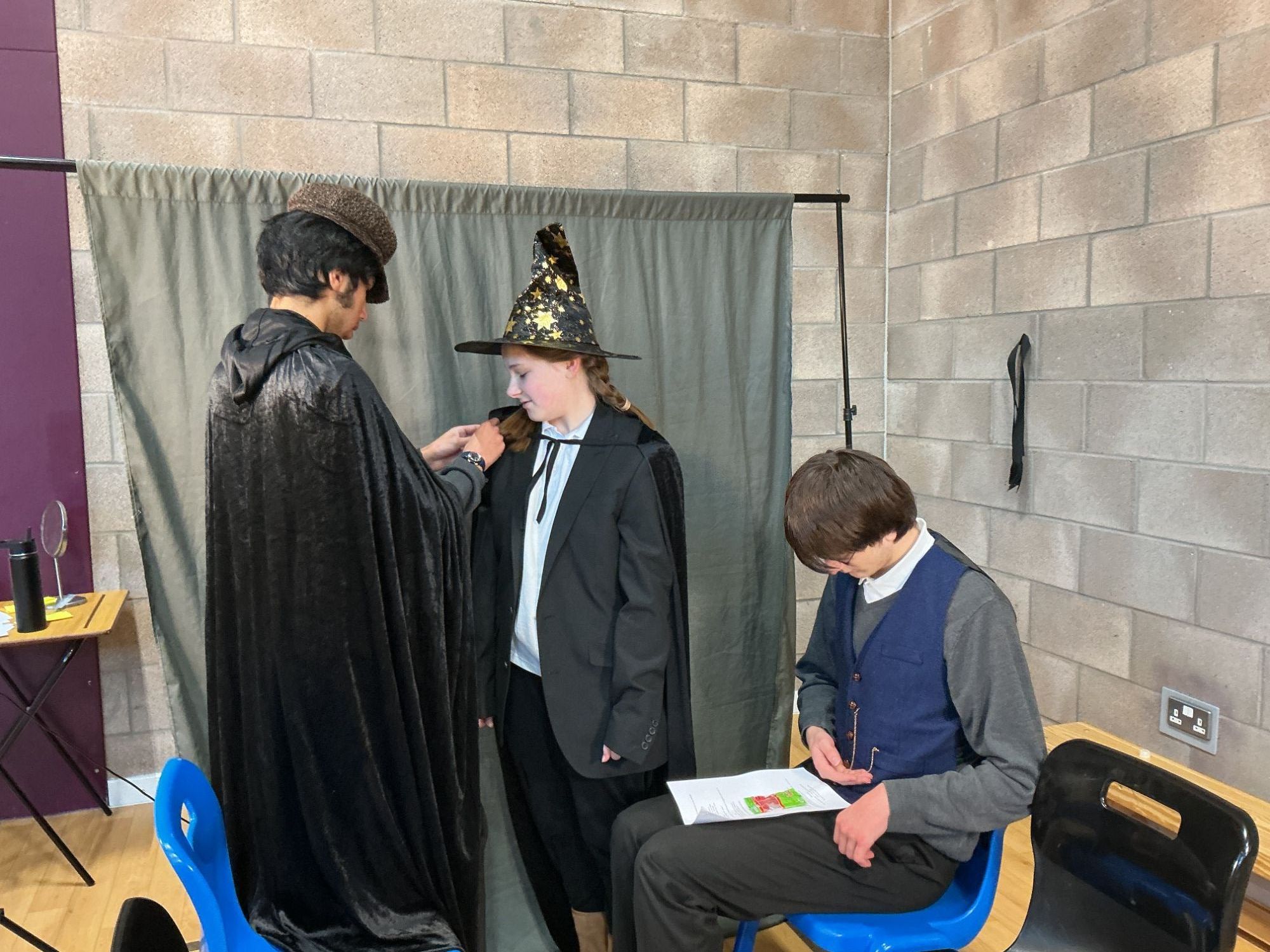 Students choosing costumes for the play