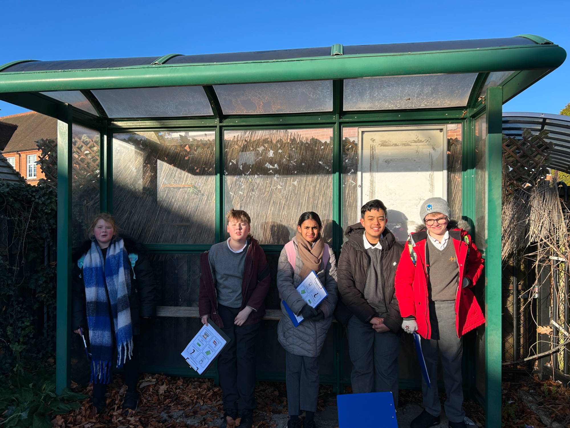 Earth class waiting at the bus stop