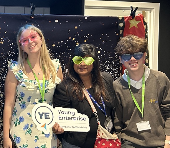 Fun photo booth Two students with their teacher celebrating in the fun photo booth