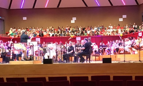 The Hexagon Theatre stage with full orchestra and audience