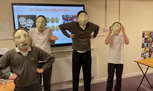 Earth Class acting with masks on