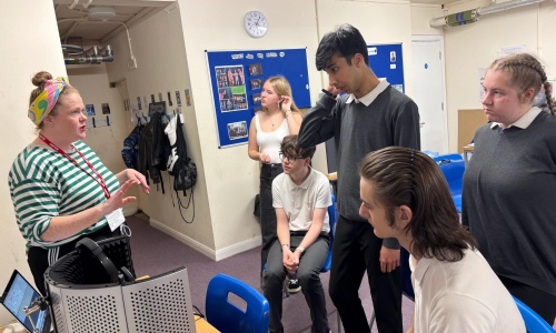 Students listening to the visiting actor about voice recording