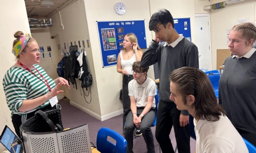 Students listening to the visiting actor about voice recording