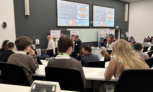 Students from team Juto listening to a presentation from Young Enterprise in a lecture theatre