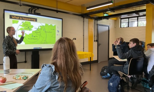 Students in a class room at Bletchley listening to a presentation from a member of staff