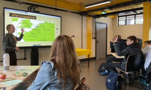 Students in a class room at Bletchley listening to a presentation from a member of staff