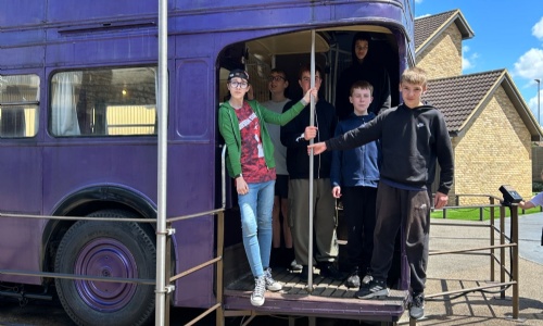Students on the magical purple Knight Bus at the Harry Potter studios