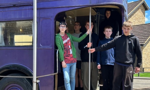 Students on the magical purple Knight Bus at the Harry Potter studios