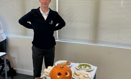 Earth Classes Halloween party food display which includes cup cakes, marshamallow teeth and filled grape eye balls. 